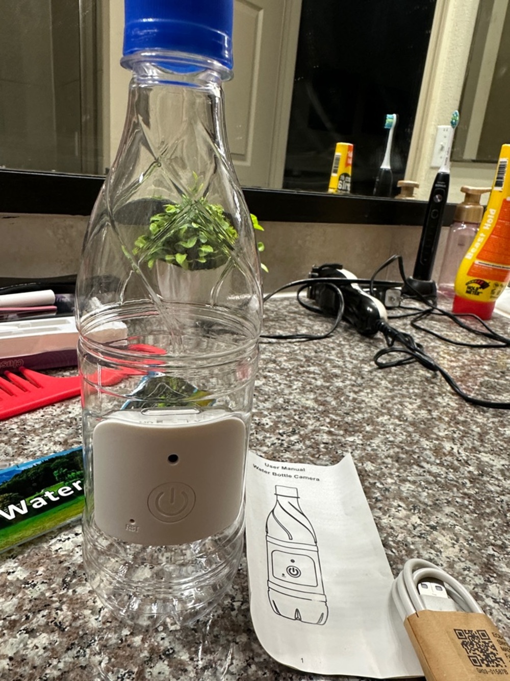 Clear Water Bottle Camera with Blue Cap